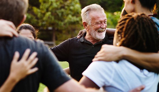 Older Orlando patient with youthful smile after dental implants