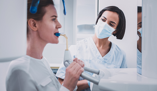 Dental patient having a C T cone beam scan taken of her mouth and jaws