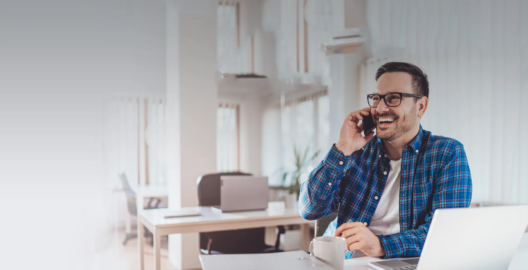 Man talking on the phone to request a dental appointment in Orlando